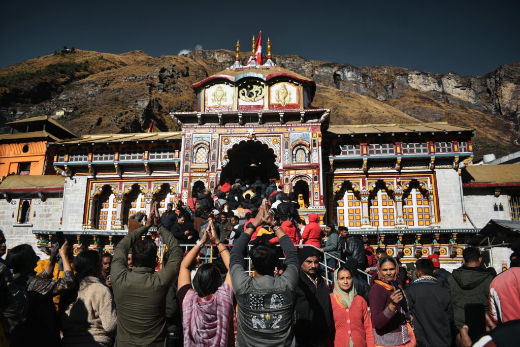 Char Dham Yatra Crowd of devotees gathered at Badrinath Temple, India, embracing spirituality.