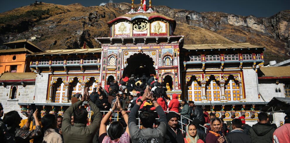 Crowd of devotees gathered at Badrinath Temple, India, embracing spirituality.